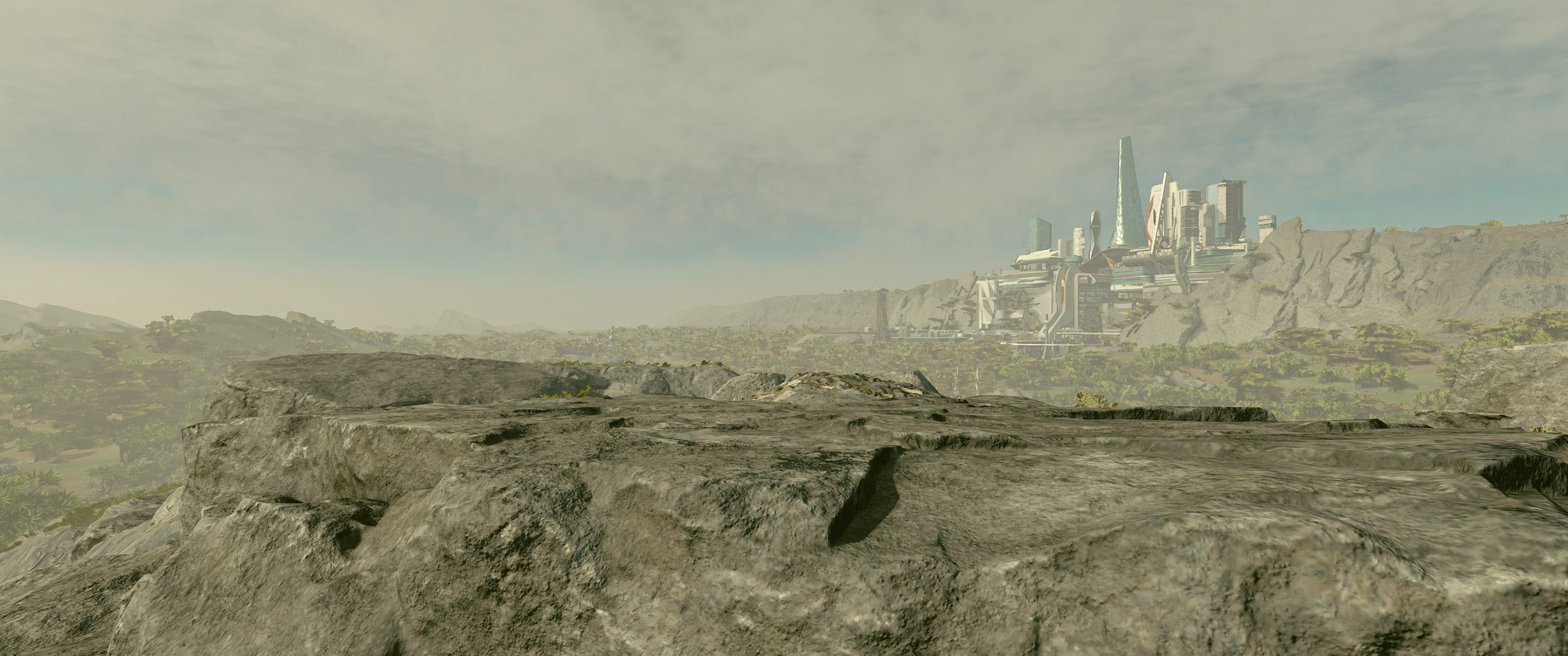 Eine Felslandschaft, im Hintergrund die futuristische Skyline einer Stadt